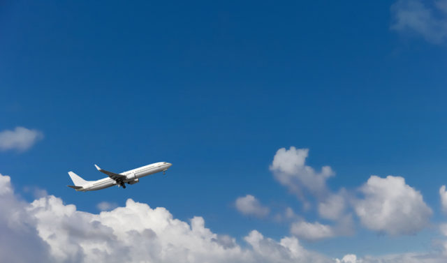 Picture of a plane above the clouds