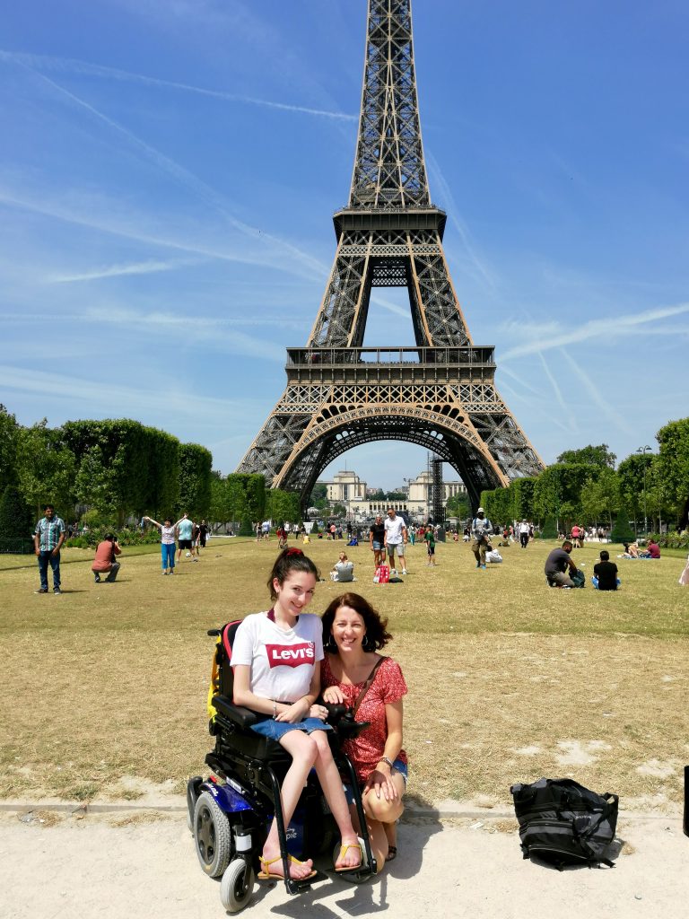 Photo shows Cheryl and Molly in front of the Eiffel Tower