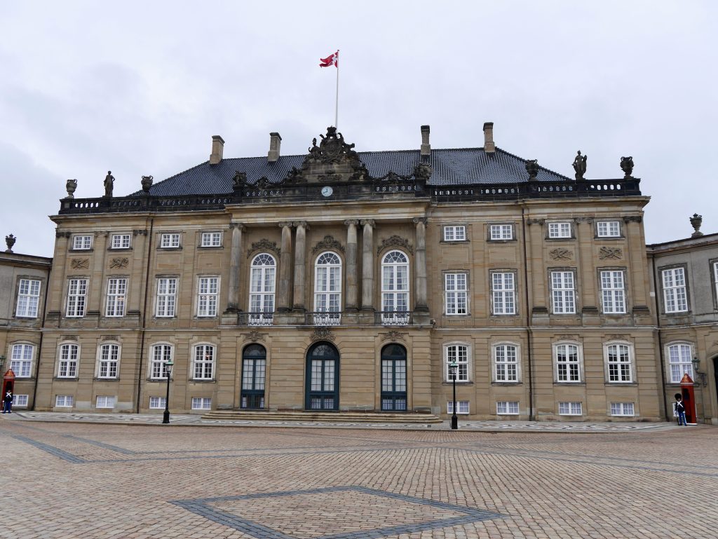 The front of the Amalienborg palace, Copenhagen.  The ground outside is easy to navigate for the wheelchair user being flat and even.