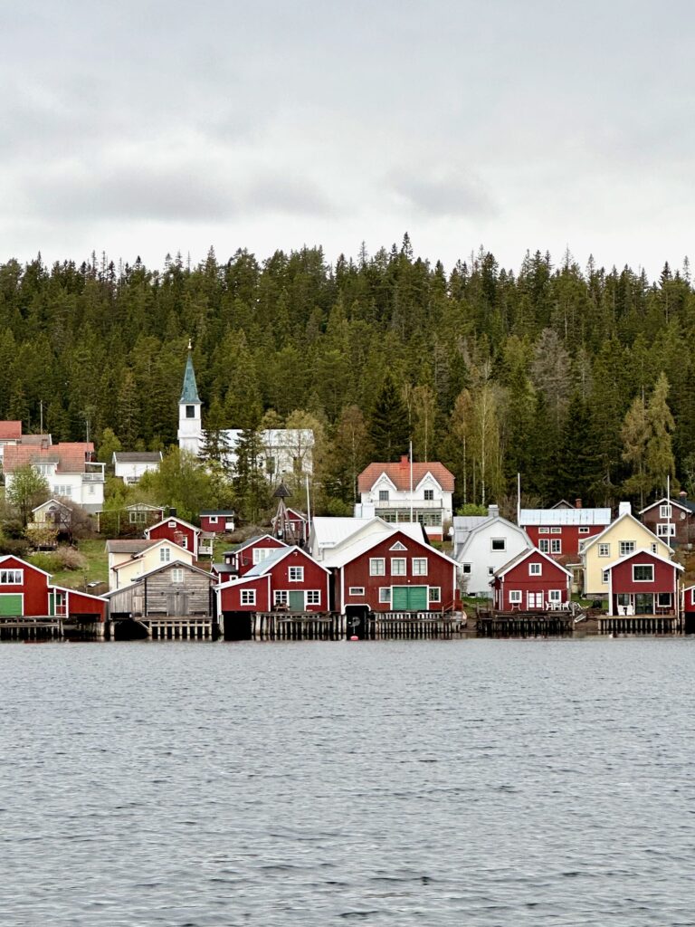 The wooden houses of North Ulvön as viewed from the water.  