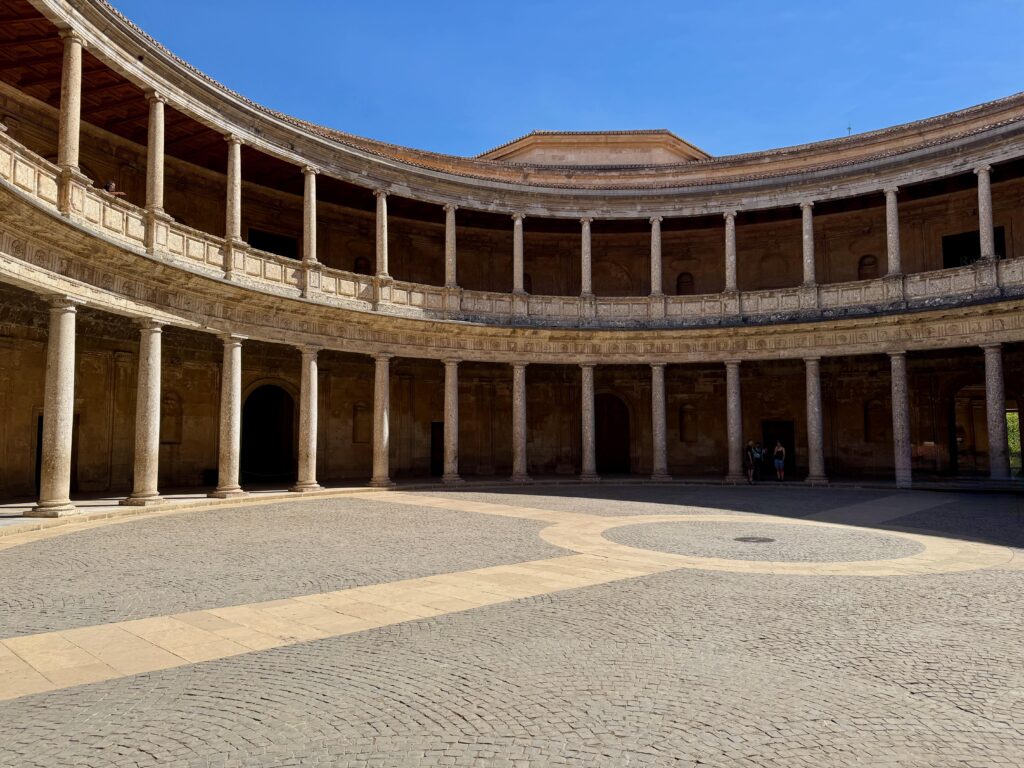 A large circular courtyard is the highlight of the Charles V Palace at the Alhambra. Although flat, a small step around the entire courtyard makes it a slight challenge for wheelchair users to access the centre.