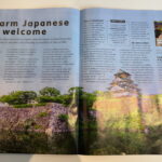 Photo of an article in a magazine detailing an accessible trip to Japan. The image shows Osaka Castle a stunning white traditional Japanese building.